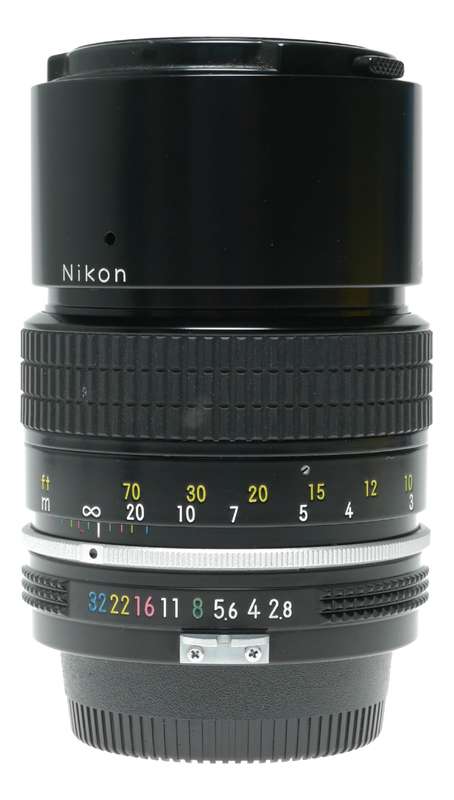 Nikon Ai Nikkor 1:2.8 135mm telephoto MF camera lens caps keeper