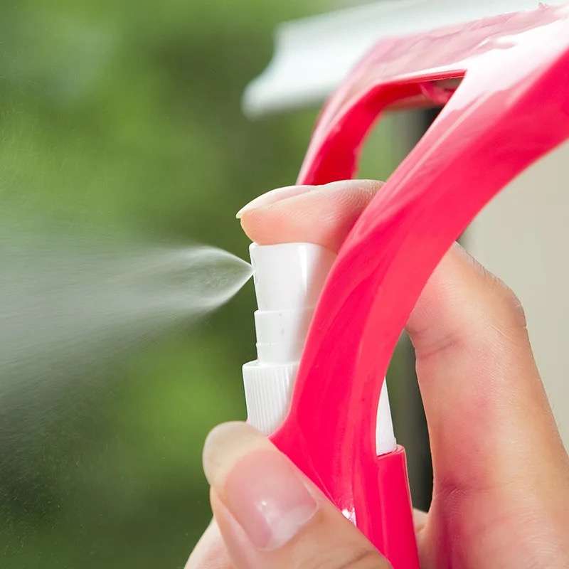 Window And Glass Cleaning Wiper With A Water Bottle