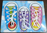 A family of three tying shoelaces