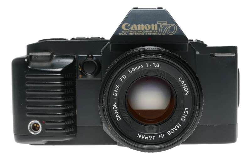 Canon T70 SLR retro film camera FD 50mm 1.8 lens strap and body cap