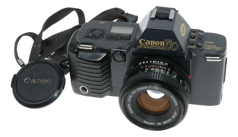 Canon T70 SLR retro film camera FD 50mm 1.8 lens strap and body cap