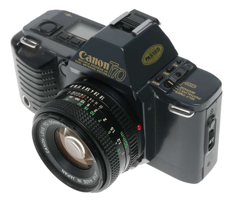 Canon T70 SLR retro film camera FD 50mm 1.8 lens strap and body cap