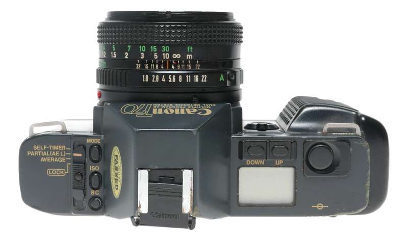 Canon T70 SLR retro film camera FD 50mm 1.8 lens strap and body cap