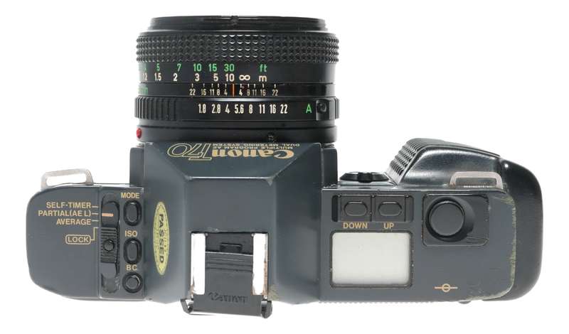Canon T70 SLR retro film camera FD 50mm 1.8 lens strap and body cap