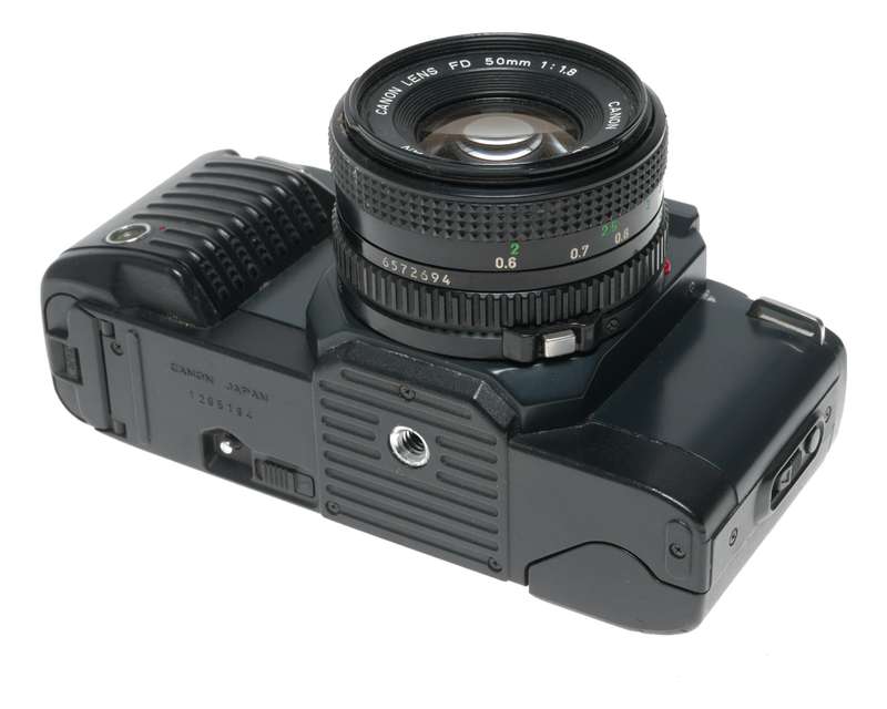 Canon T70 SLR retro film camera FD 50mm 1.8 lens strap and body cap