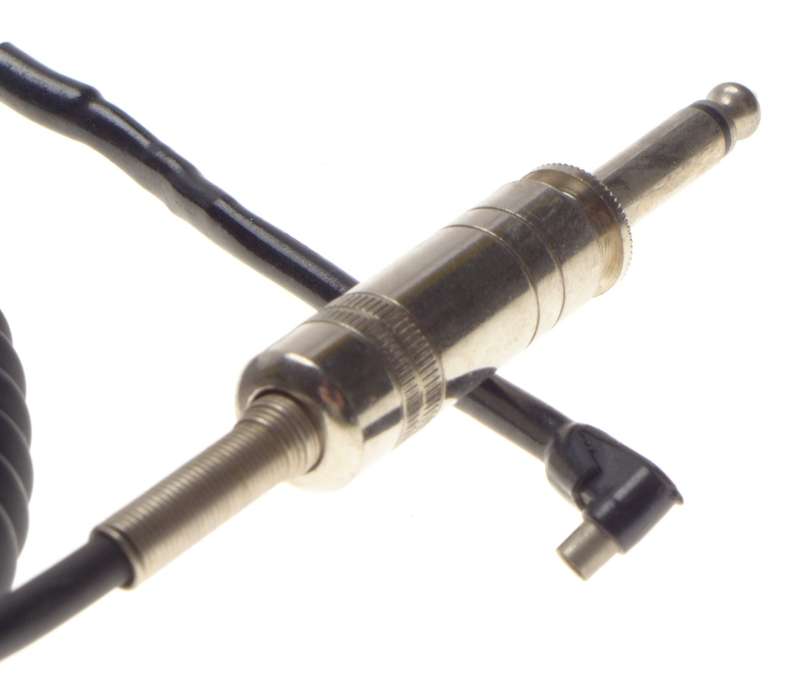 SYNC jack connecting flash camera cable coiled with headphone jack Sinar Leica