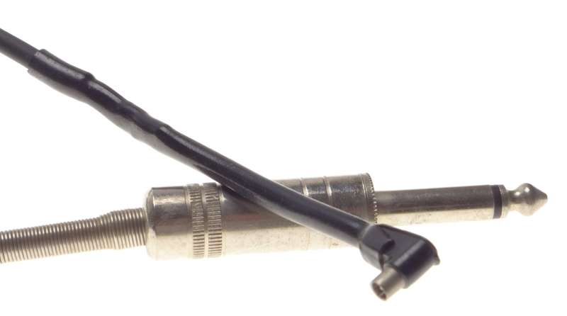 SYNC jack connecting flash camera cable coiled with headphone jack Sinar Leica