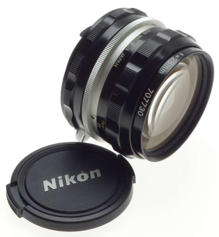f=28mm NIKKOR-H AUTO 1:3.5 f=2.8cm NIPPON 35mm SLR LENS CAPS KEEPER 3.5/28 BLACK