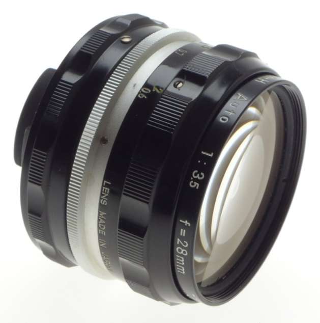 f=28mm NIKKOR-H AUTO 1:3.5 f=2.8cm NIPPON 35mm SLR LENS CAPS KEEPER 3.5/28 BLACK