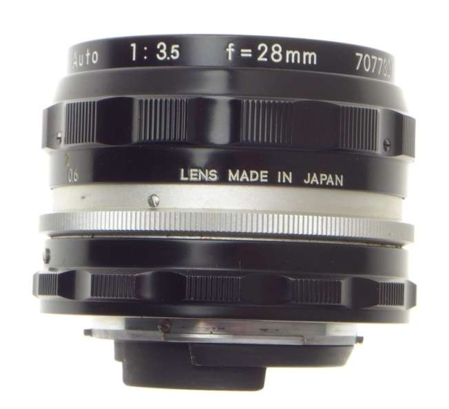 f=28mm NIKKOR-H AUTO 1:3.5 f=2.8cm NIPPON 35mm SLR LENS CAPS KEEPER 3.5/28 BLACK