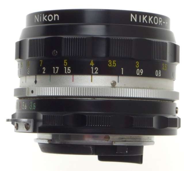 f=28mm NIKKOR-H AUTO 1:3.5 f=2.8cm NIPPON 35mm SLR LENS CAPS KEEPER 3.5/28 BLACK