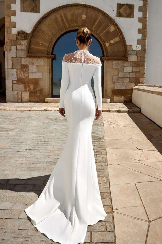 (Rental)Rihanna, halter neck long sleeve with pearl detail sheath wedding dress.