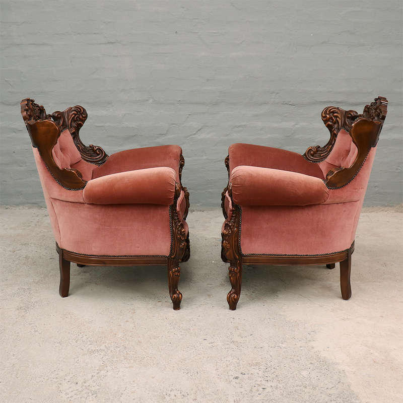 Heavily carved Armchairs