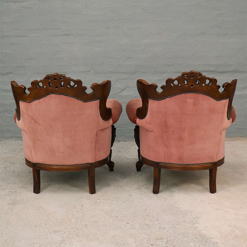 Heavily carved Armchairs