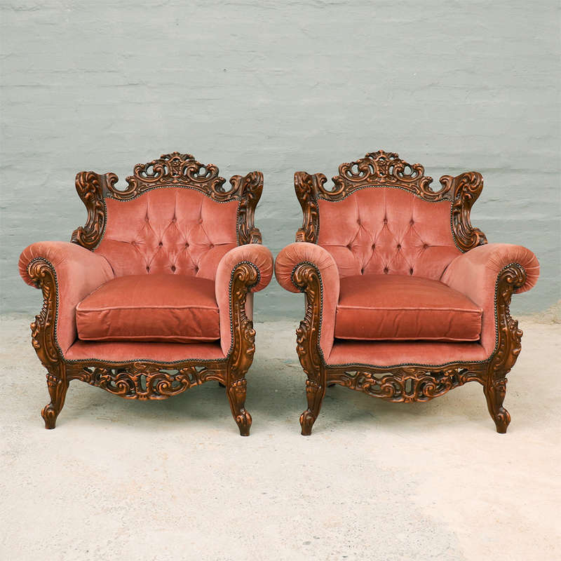 Heavily carved Armchairs