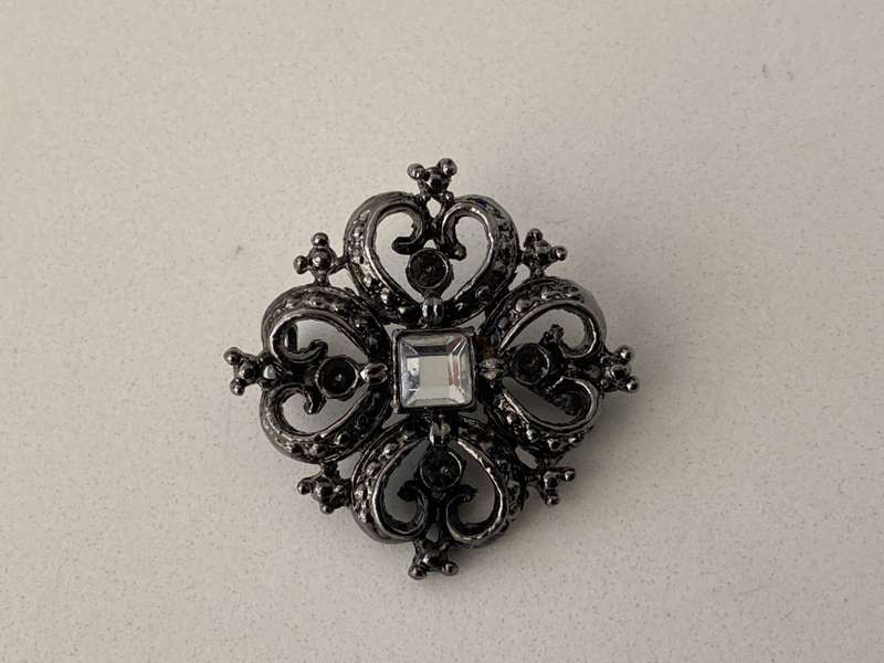 Brooch - Black Colour Square With Heart Shapes. Has A White Bead in Centre #ML681