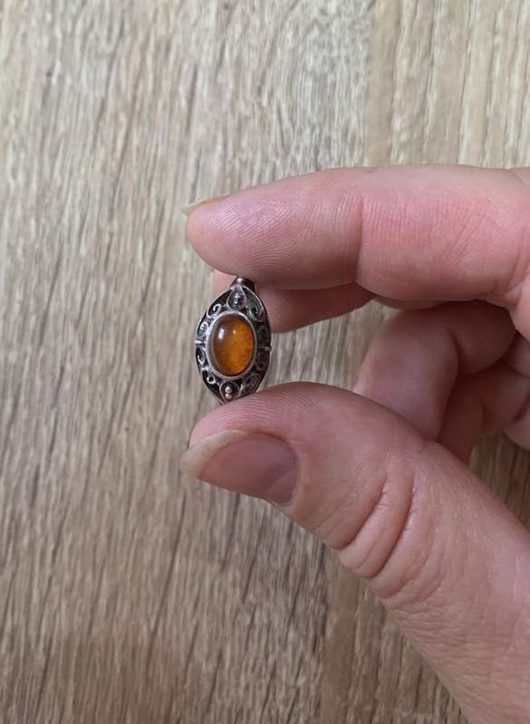 925 Silver Ring With Orange Stone On Raised Setting Surrounded By Swirls #ML700R195.00 | Dimensi...