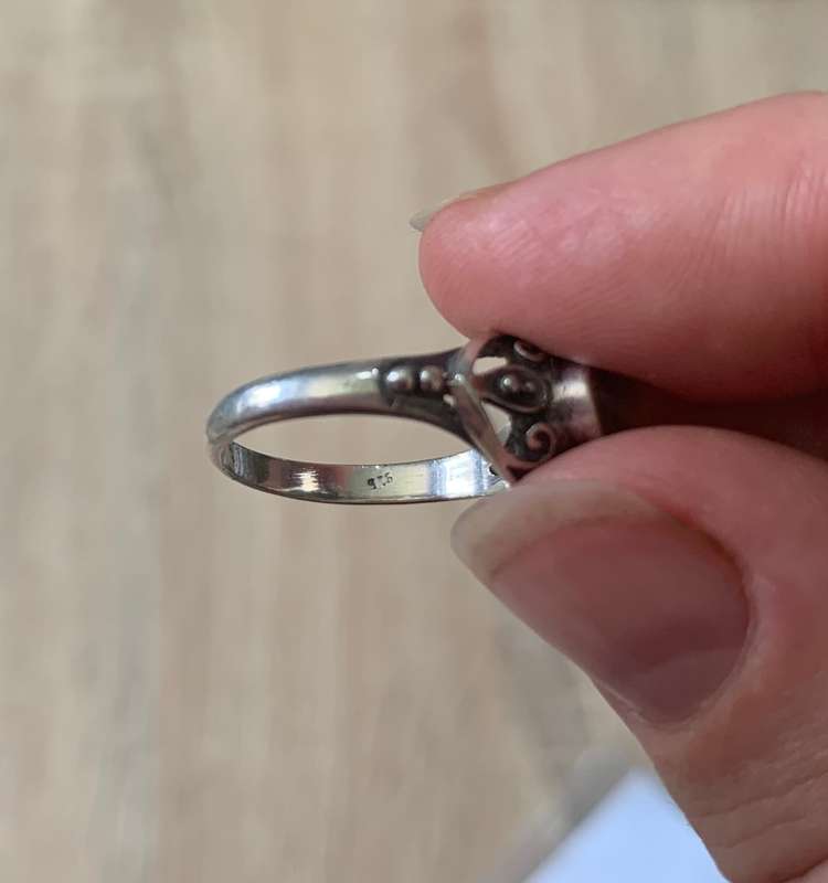 925 Silver Ring With Orange Stone On Raised Setting Surrounded By Swirls #ML700R195.00 | Dimensi...