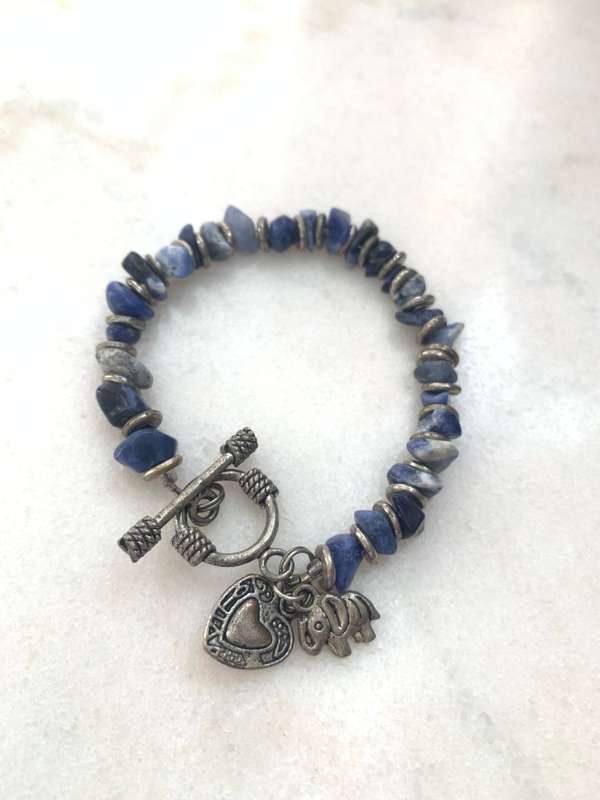 Bracelet With Irregular Shaped Blue Stones Split By Silver Coloured Round Beads With Pretty Clasp...
