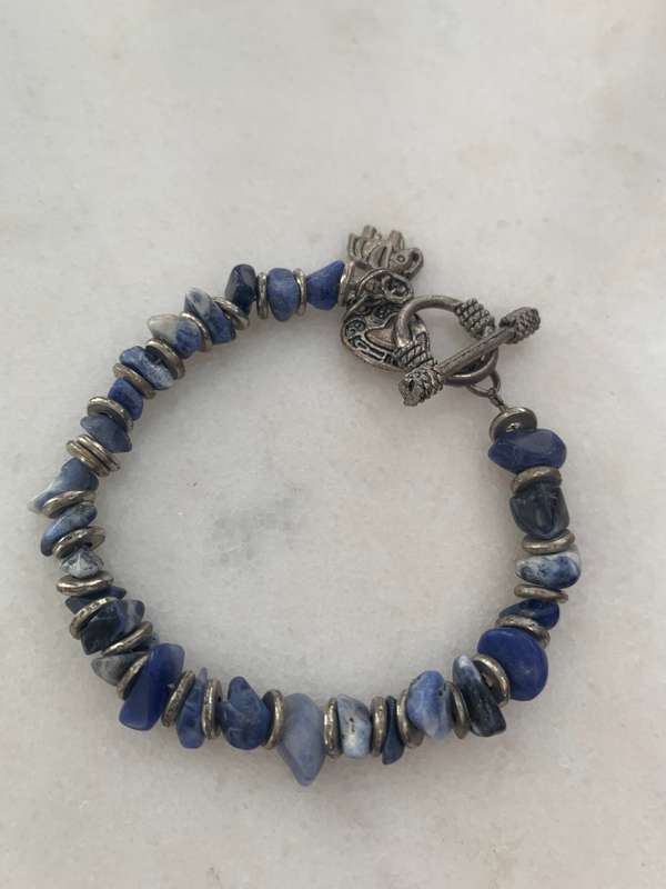 Bracelet With Irregular Shaped Blue Stones Split By Silver Coloured Round Beads With Pretty Clasp...