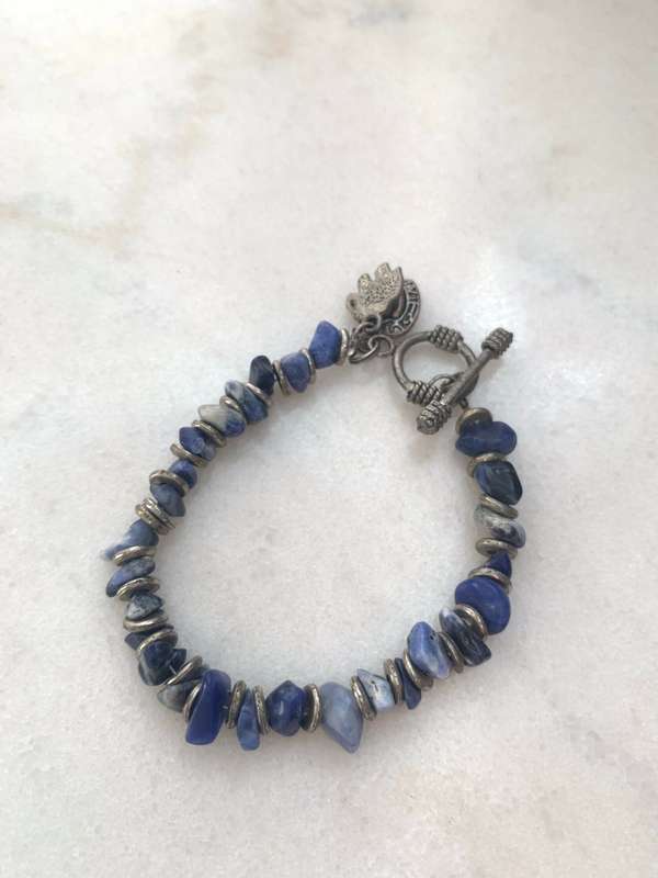 Bracelet With Irregular Shaped Blue Stones Split By Silver Coloured Round Beads With Pretty Clasp...
