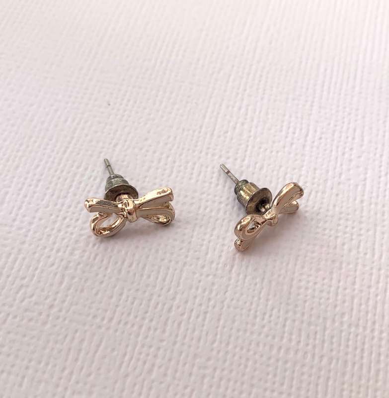 Earrings - Bow Studs. Rose Gold and White Colour #ML1011 R180.00 | Dimensions: 10mm x 5mm