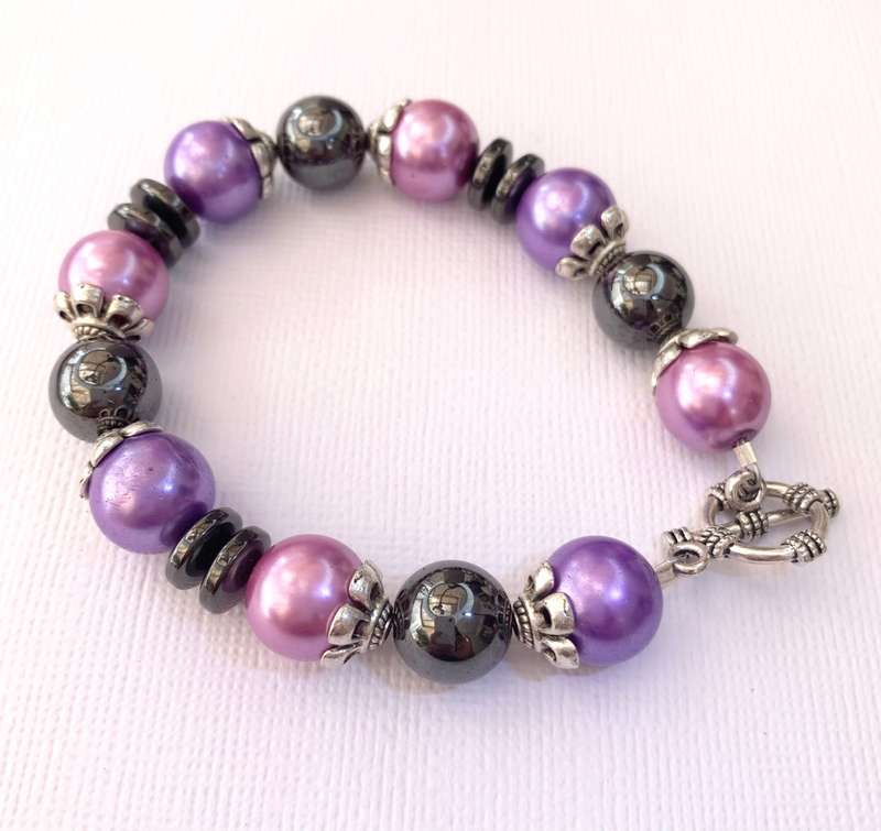 Bracelet - Pink, Purple, Black Beads With Silver Fittings On Wire With Silver Colour Clasp. Bit o...