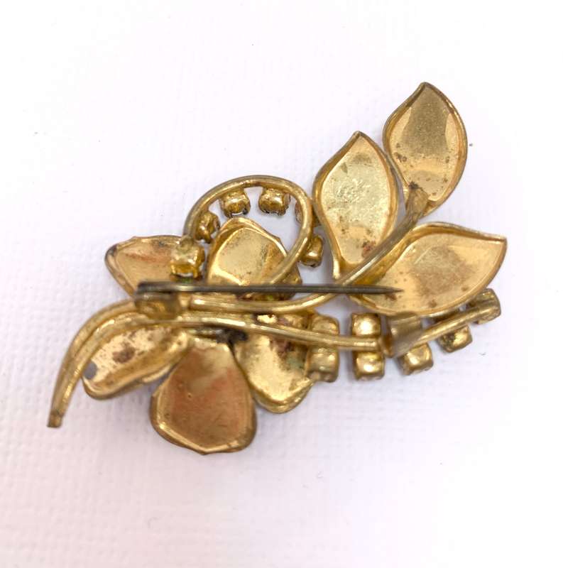 Brooch - Shiny blueish Stones With Fluted Flowers. Gold Colour #ML1037 R195.00 | Dimensions: 54mm...