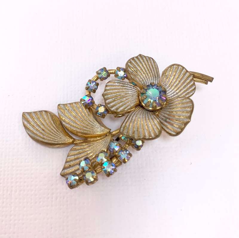 Brooch - Shiny blueish Stones With Fluted Flowers. Gold Colour #ML1037 R195.00 | Dimensions: 54mm...