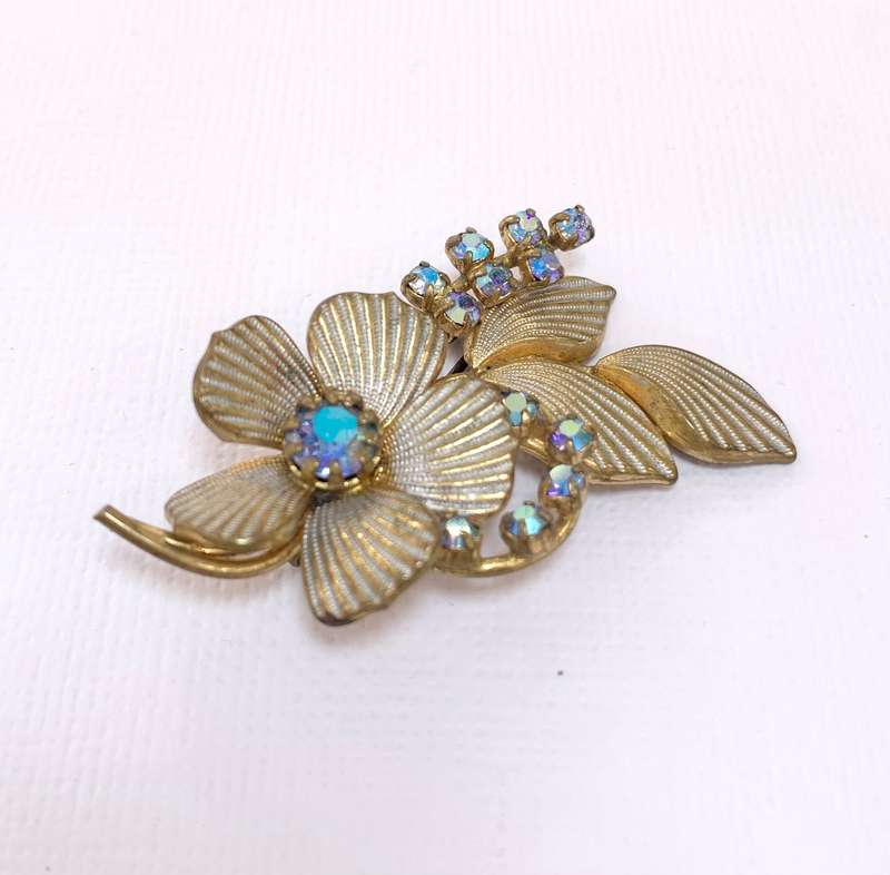 Brooch - Shiny blueish Stones With Fluted Flowers. Gold Colour #ML1037 R195.00 | Dimensions: 54mm...