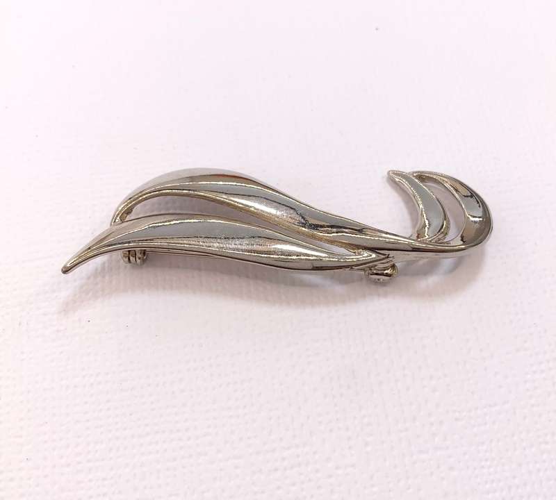 Brooch - Double Swirl. Silver Colour #ML1040 R199.00| Dimensions: 57mm x 14mm