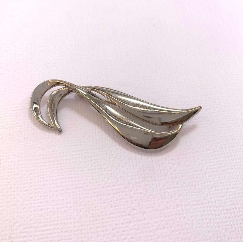 Brooch - Double Swirl. Silver Colour #ML1040 R199.00| Dimensions: 57mm x 14mm