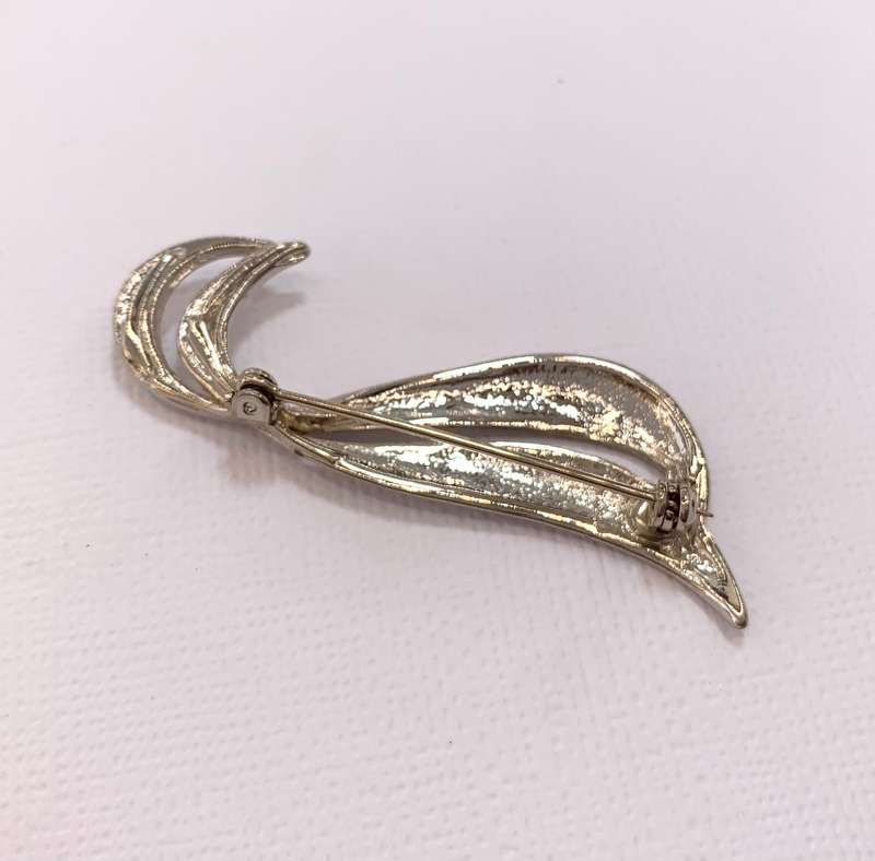 Brooch - Double Swirl. Silver Colour #ML1040 R199.00| Dimensions: 57mm x 14mm