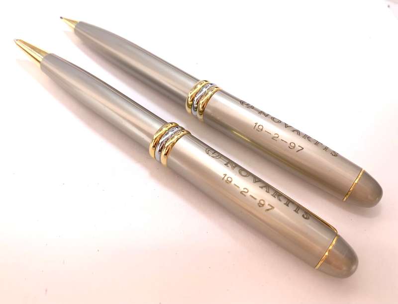 Pen Set - Ballpoint and Clutch Pencil. Brand Novartis Presentation. Gold and Silver Colour. Inscr...