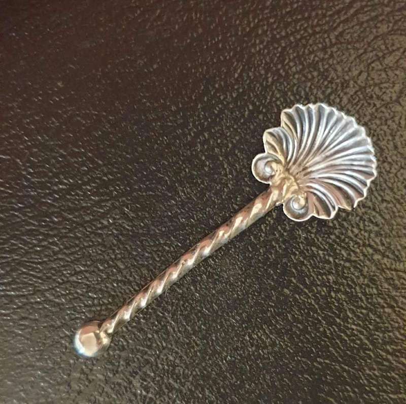 Elegant antique sterling silver salt/mustard spoon. Shell Pattern. Twist handle. Marked " C&N ste...