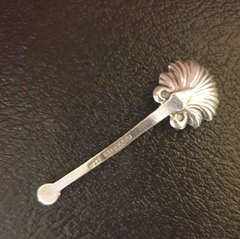 Elegant antique sterling silver salt/mustard spoon. Shell Pattern. Twist handle. Marked " C&N ste...