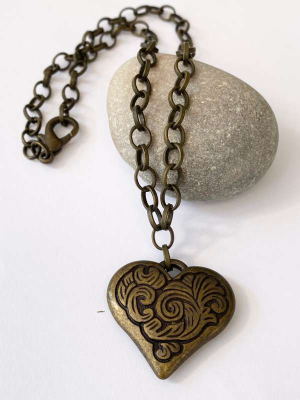 ML1600NecklaceNecklace - Rustic Metal Patterned Heart Pendant on Rustic Metal Chain250.00Rus...
