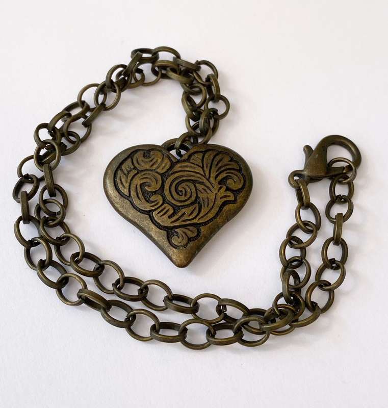 ML1600NecklaceNecklace - Rustic Metal Patterned Heart Pendant on Rustic Metal Chain250.00Rus...