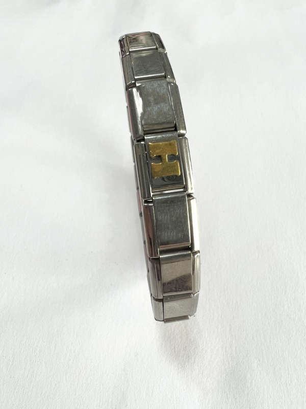 Bracelet - Stainless Steel Nomination Bracelet. One Gold Coloured H Link. (20 Links in total) ML1798