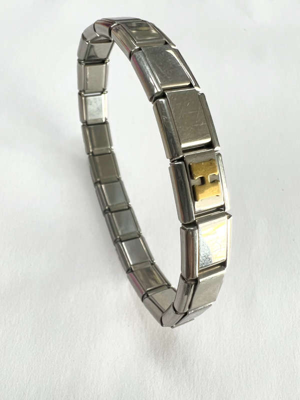 Bracelet - Stainless Steel Nomination Bracelet. One Gold Coloured H Link. (20 Links in total) ML1798