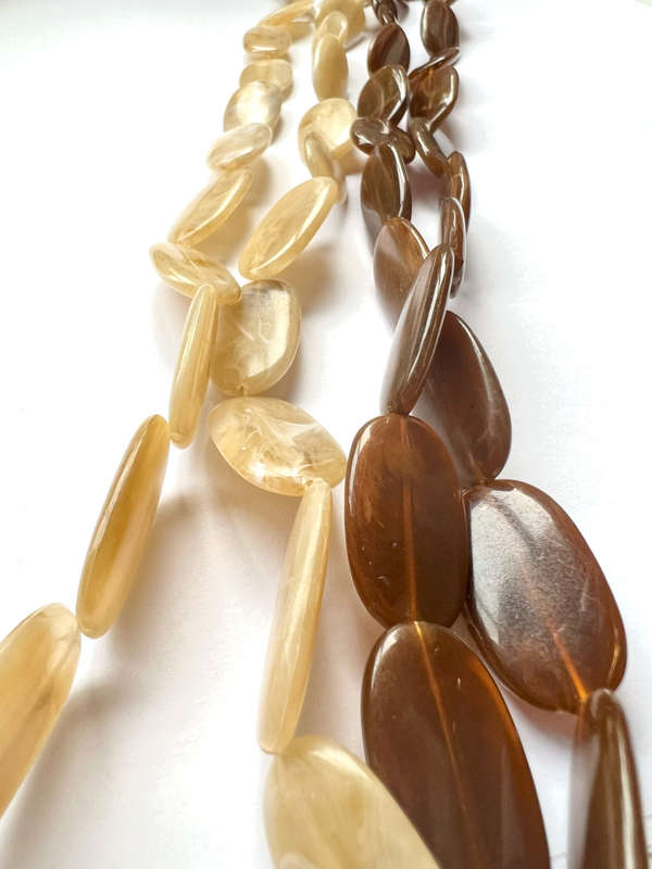 Necklace - Retro Plastic Beaded Design. One Cream Oval Shaped Beads. One Brown Oval Shaped Beads ...