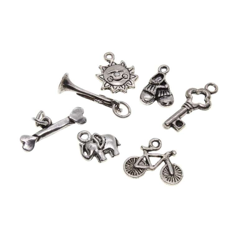 Charms - Silver Tone pack of 7 Charms. Bicycle, Elephant, Sun, Shoes, Bone, Key & Trumpet - ML3129