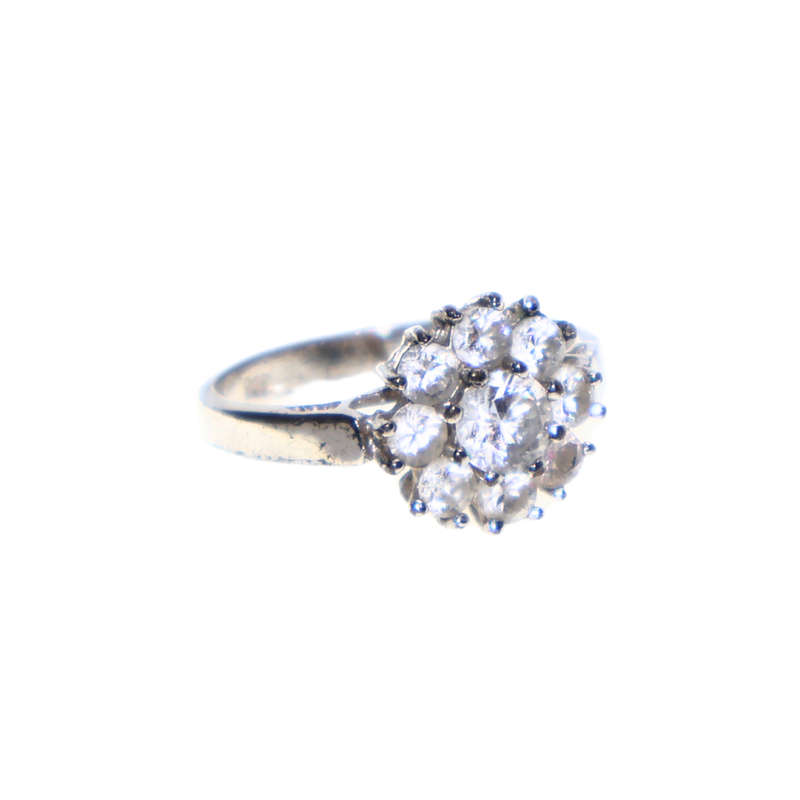 Ring - 925 Silver flower design. Large centre stone surrounded  with smaller stones - ML3670
