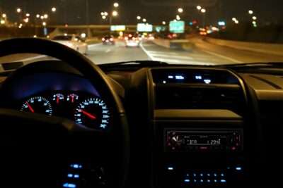 Night time shot of the MEX-N4300BT coloured display matching the car's dashboard