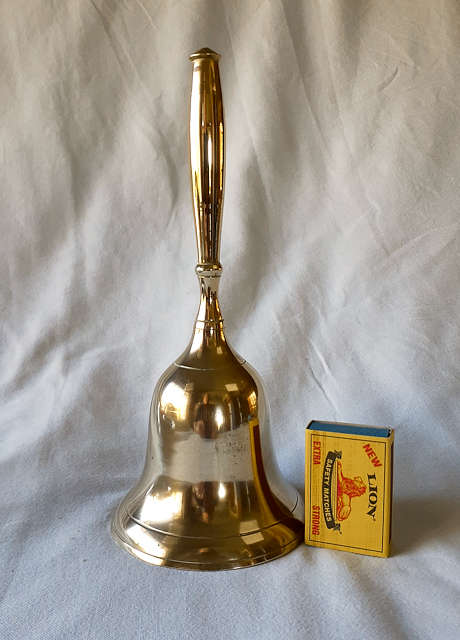 Brass bell with brass handle 22cms tall