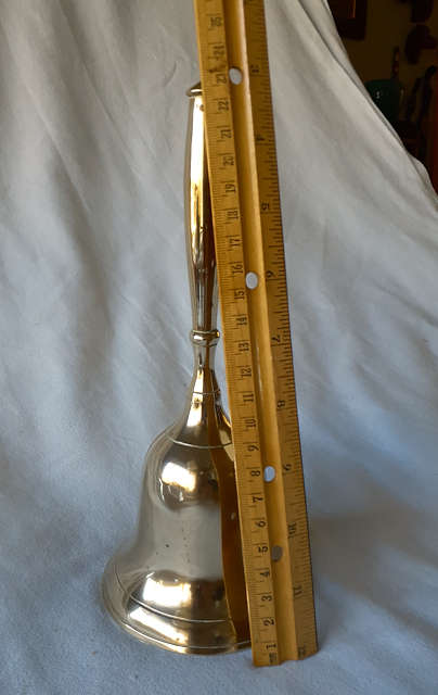 Brass bell with brass handle 22cms tall