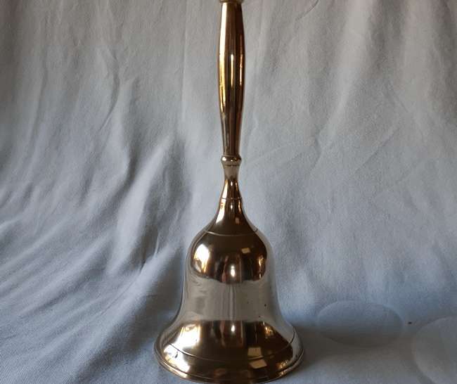 Brass bell with brass handle 22cms tall
