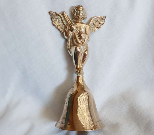 Brass bell with angel cherub playing mandolin