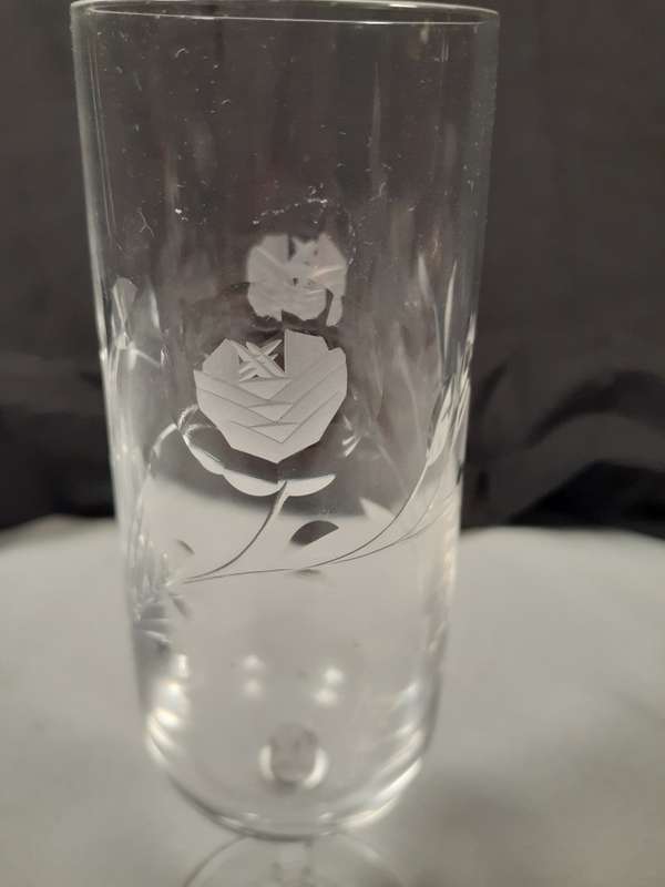 Two rose cut crystal wine glasses  17 and 19 cms tall