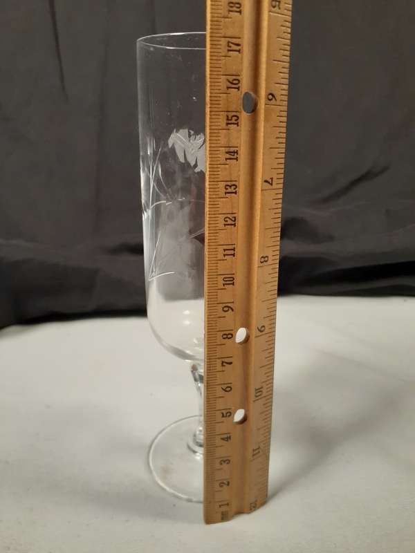 Two rose cut crystal wine glasses  17 and 19 cms tall